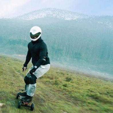 heavy rider riding an electric skateboard off road
