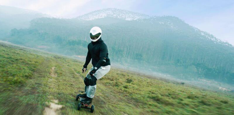 heavy rider riding an electric skateboard off road